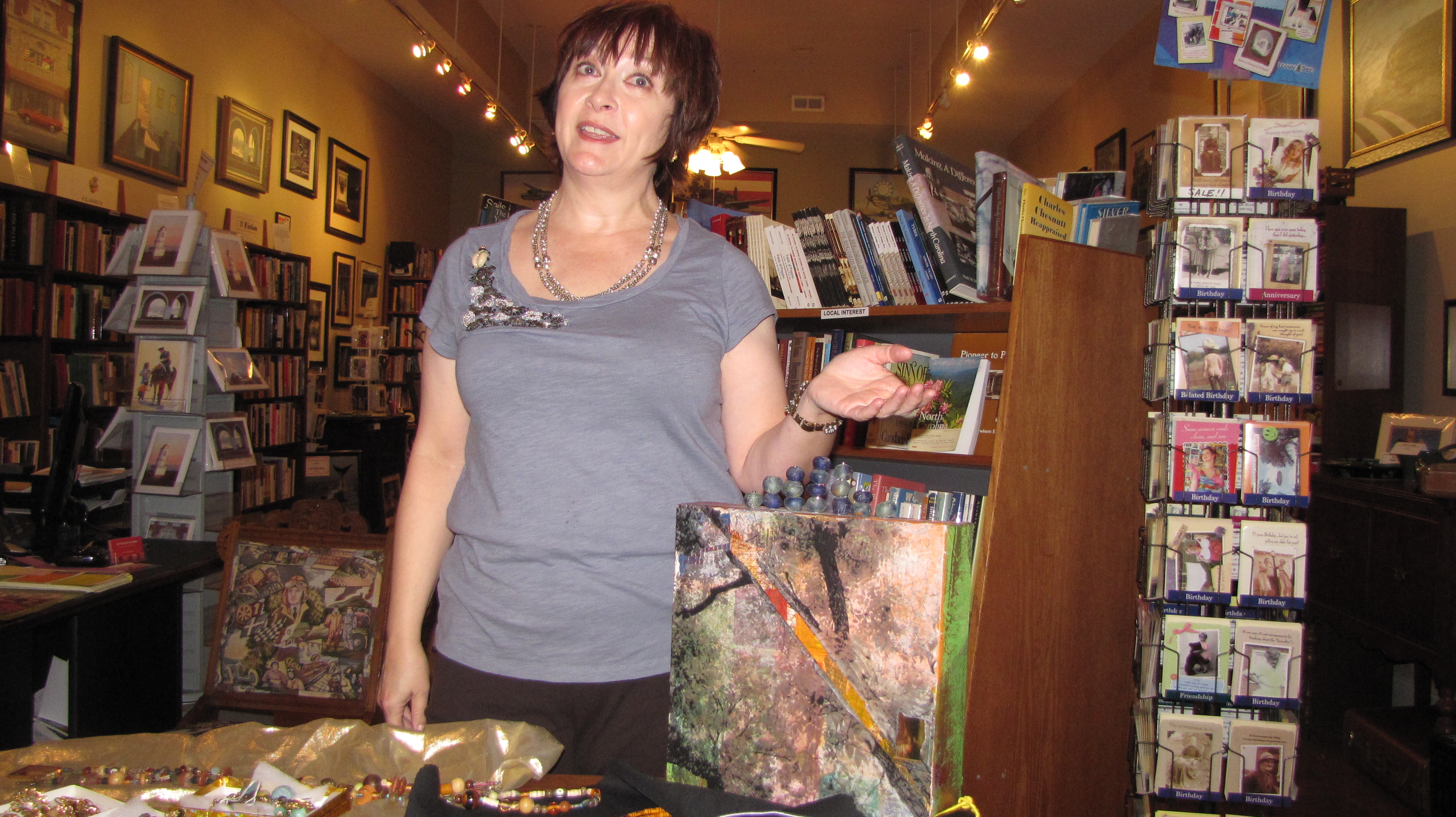 Susie Godwin describes her artwork inside City Center Gallery and Books.